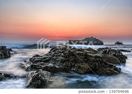 The rocky landscape of Tashiro Coast floating in the sea at dawn. The rocky landscape of Tashiro Coast floating in the sea at dawn. 139704696