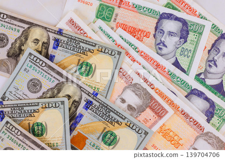 Cuban pesos currency CUC banknotes assorted denomination from Cuba, American hundred dollar bills Cuban pesos currency CUC banknotes assorted denomination from Cuba, American hundred dollar bills 139704706