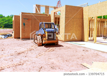 Construction site with equipment working on building new beams structure 139704715