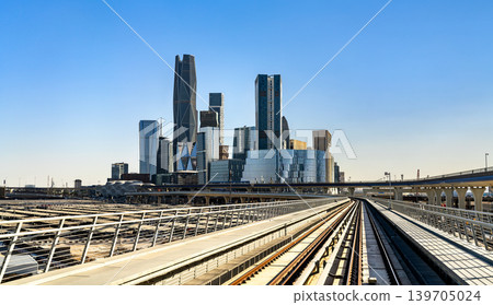 View of the King Abdullah Financial District skyscrapers from the metro railway tracks in Riyadh, Saudi Arabia. View of the King Abdullah Financial District skyscrapers from the metro railway tracks in Riyadh, Saudi Arabia. 139705024