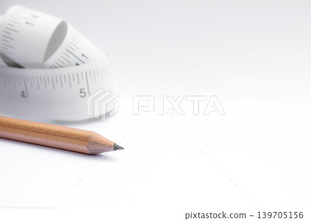 Close-up paper measuring tape roll  isolated on white background with copy space 139705156
