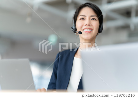 Female operator talking on intercom 139705210