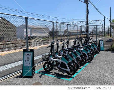 Electric-assist bicycles parked at the port in front of the station Electric-assist bicycles parked at the port in front of the station 139705247