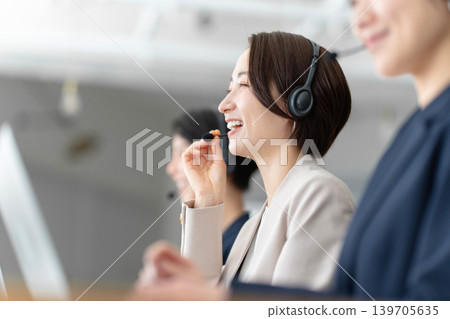 Operator working in a call center Operator working in a call center 139705635