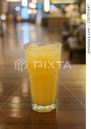 Mango juice served in a glass on the table 139705647