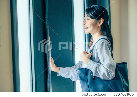 A woman about to go out A woman about to go out 139705900