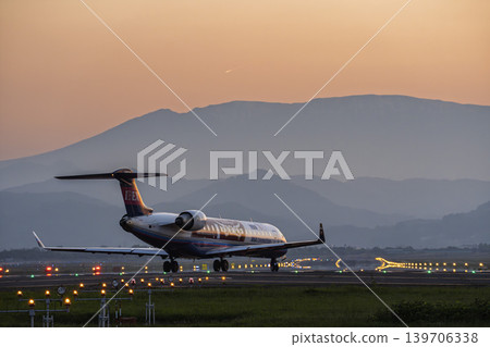 Sendai Airport at dusk, plane taxiing, Natori City, Miyagi Prefecture Sendai Airport at dusk, plane taxiing, Natori City, Miyagi Prefecture 139706338