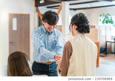 Businessmen shaking hands to greet, introduce themselves and conclude a contract in a corporate office 139706969