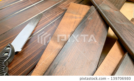 Wood and saw for DIY projects Wood and saw for DIY projects 139706980