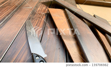 Wood and saw for DIY projects Wood and saw for DIY projects 139706982
