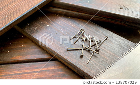 Wood, saw, and nails Wood, saw, and nails 139707029