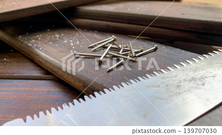 Wood, saw, and nails Wood, saw, and nails 139707030