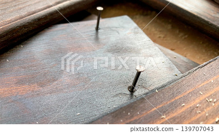 Exposed nails and wood surface Exposed nails and wood surface 139707043