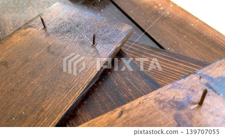 Exposed nails and wood surface Exposed nails and wood surface 139707055