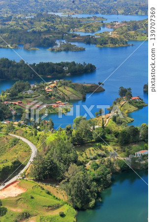 The breathtaking scenery and emerald green waters of Lake Guatapé, a hidden gem in Colombia, South America. The breathtaking scenery and emerald green waters of Lake Guatapé, a hidden gem in Colombia, South America. 139707369
