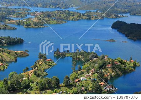 The breathtaking scenery and emerald green waters of Lake Guatapé, a hidden gem in Colombia, South America. The breathtaking scenery and emerald green waters of Lake Guatapé, a hidden gem in Colombia, South America. 139707370