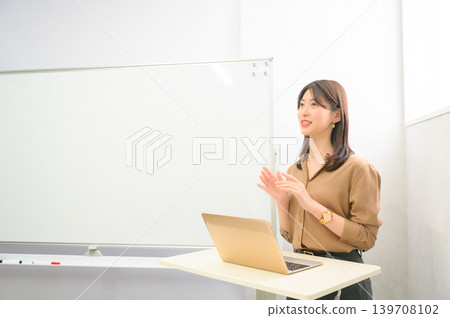 A Japanese woman making a presentation 139708102