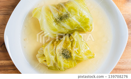 Cabbage rolls placed on a wooden table Cabbage rolls placed on a wooden table 139708276