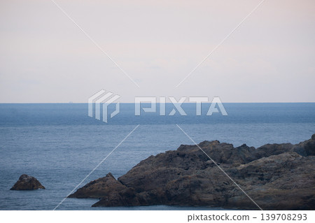 A tranquil view of the Sea of Japan and rocky shores. A tranquil view of the Sea of Japan and rocky shores. 139708293