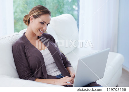Woman, laptop and relax on sofa for remote work, update blog post and digital news on social media at home. Happy freelancer, computer and person on house living room couch with website technology Woman, laptop and relax on sofa for remote work, update blog post and digital news on social media at home. Happy freelancer, computer and person on house living room couch with website technology 139708366