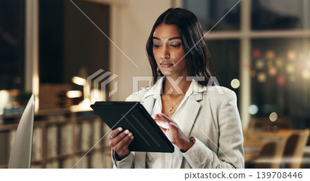 Night, tablet and business woman typing, scroll and manager review journalist story, social media blog and working late. Professional news reporter, reading and Indian person check online article Night, tablet and business woman typing, scroll and manager review journalist story, social media blog and working late. Professional news reporter, reading and Indian person check online article 139708446