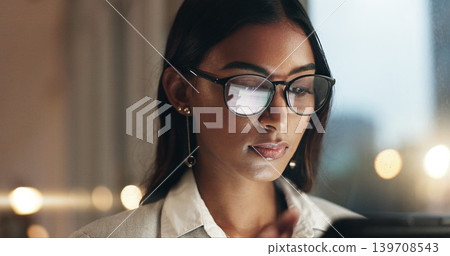 Tablet, overtime and happy woman in office with glasses, reflection with planning and website. Vision, smile and businesswoman typing email, late at night work and research on future ideas for agency Tablet, overtime and happy woman in office with glasses, reflection with planning and website. Vision, smile and businesswoman typing email, late at night work and research on future ideas for agency 139708543