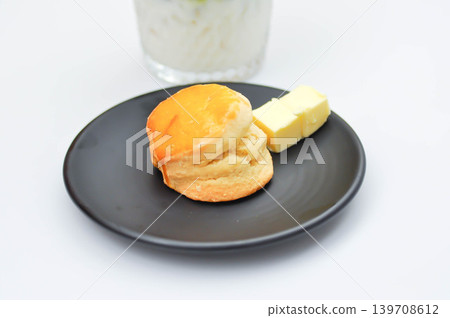 scone and butter with iced green tea, iced green tea latte or iced matcha or iced matcha green tea scone and butter with iced green tea, iced green tea latte or iced matcha or iced matcha green tea 139708612
