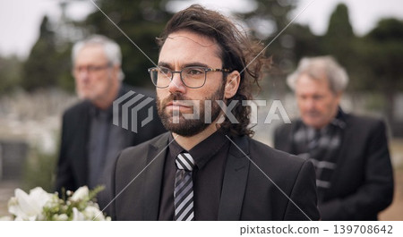Funeral, death and man carry coffin with family in grief, mourning and sad during church service for peace. Memorial, difficult and person with loss walking in the wind with casket in a ceremony Funeral, death and man carry coffin with family in grief, mourning and sad during church service for peace. Memorial, difficult and person with loss walking in the wind with casket in a ceremony 139708642