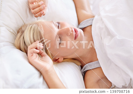 Peace, sleeping and tired woman in a bed resting, dreaming and comfortable in her home. Eyes closed, face and female person asleep in a bedroom with vacation, holiday or snooze on day off in a house Peace, sleeping and tired woman in a bed resting, dreaming and comfortable in her home. Eyes closed, face and female person asleep in a bedroom with vacation, holiday or snooze on day off in a house 139708716
