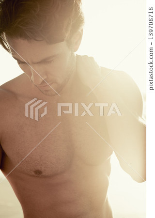 Sunset, muscular and man with holiday, beach and tropical island with weekend break and getaway trip. Person, bodybuilder and guy with lens flare and seaside with aesthetic and outdoor with fitness 139708718