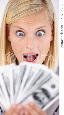 Excited, woman wow and money with dollars, investment and savings for budget with reward. Wealth, wondering and happy person smile with cash profit from work bonus in studio with white background Excited, woman wow and money with dollars, investment and savings for budget with reward. Wealth, wondering and happy person smile with cash profit from work bonus in studio with white background 139708729