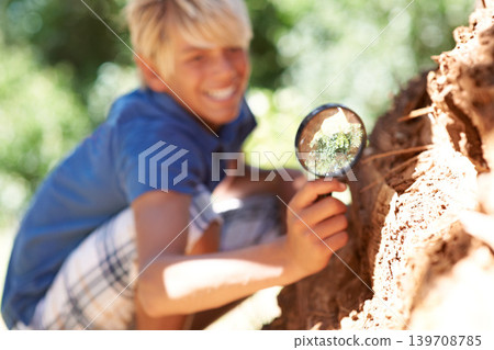 Magnifying glass, search and nature with curious boy outdoor in park, garden or field for discovery. Kids, learning and explore with young child in green environment for summer camp or biology Magnifying glass, search and nature with curious boy outdoor in park, garden or field for discovery. Kids, learning and explore with young child in green environment for summer camp or biology 139708785
