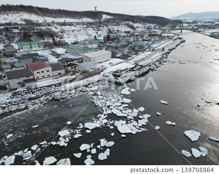 Aerial view of the winter scenery of the town near the mouth of the Toro River in Kitami City, Hokkaido. 139708864