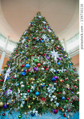 A giant Christmas tree adorned with colorful ornaments in Orlando, Florida. A giant Christmas tree adorned with colorful ornaments in Orlando, Florida. 139710116