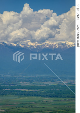 Alazani Valley and Greater Caucasus mountain range in Sighnaghi town, Kakheti region of Georgia Alazani Valley and Greater Caucasus mountain range in Sighnaghi town, Kakheti region of Georgia 139710190