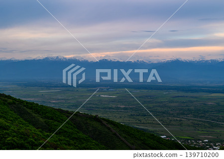 Alazani Valley and Greater Caucasus mountain range in Sighnaghi town, Kakheti region of Georgia Alazani Valley and Greater Caucasus mountain range in Sighnaghi town, Kakheti region of Georgia 139710200