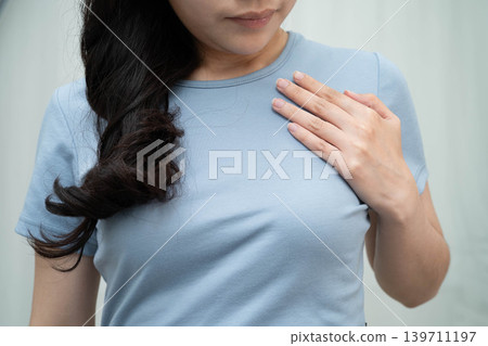 Asian woman self touching check lump or Breast cancer, Breast Self Exam. Asian woman self touching check lump or Breast cancer, Breast Self Exam. 139711197