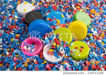 Bangkok, Thailand April 20, 2024 Plastic recycle pellets and caps for industrial use. Bangkok, Thailand April 20, 2024 Plastic recycle pellets and caps for industrial use. 139711290