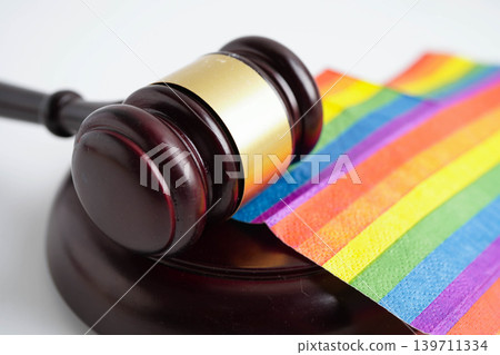 Gavel for judge lawyer on rainbow flag, symbol of LGBT pride month. 139711334