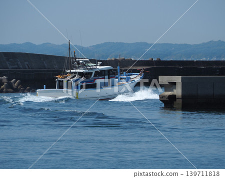 Small boats leaving the harbor Small boats leaving the harbor 139711818