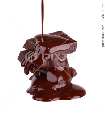 Liquid chocolate syrup pouring over a stack of chocolate pieces isolated on a white background. Clipping path. Liquid chocolate syrup pouring over a stack of chocolate pieces isolated on a white background. Clipping path. 139711957