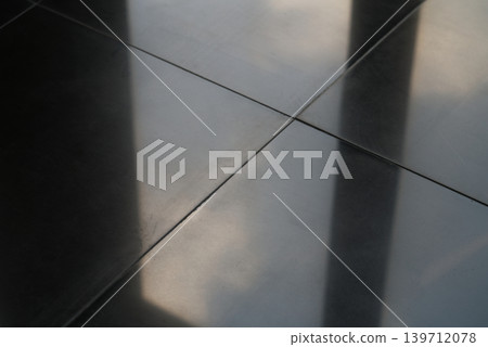 Abstract Close-up of Polished Black Floor Tiles with Cross Grout Lines and Soft Reflections Abstract Close-up of Polished Black Floor Tiles with Cross Grout Lines and Soft Reflections 139712078