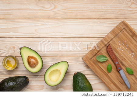 Healthy avocado cooking ingredients wooden background Healthy avocado cooking ingredients wooden background 139712245