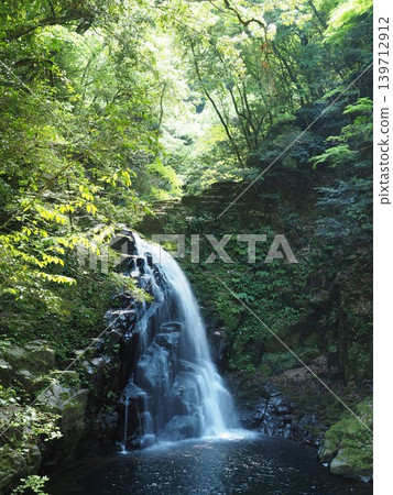 A representative and magnificent waterfall of the Akame Five Waterfalls. The mystical atmosphere of Fudo Falls, bathed in the soft light of early summer. A representative and magnificent waterfall of the Akame Five Waterfalls. The mystical atmosphere of Fudo Falls, bathed in the soft light of early summer. 139712912
