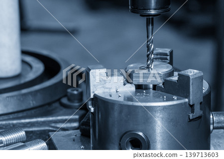 High-precision hole tapping process for internal threading on a milling machine in a light blue industrial scene. High-precision hole tapping process for internal threading on a milling machine in a light blue industrial scene. 139713603