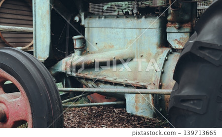 Vintage Rusty Tractor Behind Wooden Fence Vintage Rusty Tractor Behind Wooden Fence 139713665