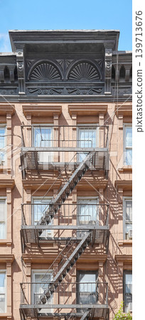 Old building with iron fire escape, New York City, USA. Old building with iron fire escape, New York City, USA. 139713676