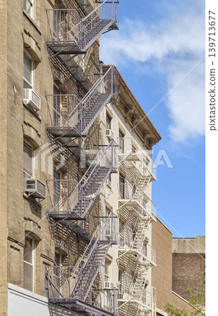 Old building with iron fire escape, New York City, USA. Old building with iron fire escape, New York City, USA. 139713677
