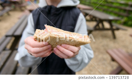 Child Having Lunch at a Wildlife Park Picnic Area Child Having Lunch at a Wildlife Park Picnic Area 139713728