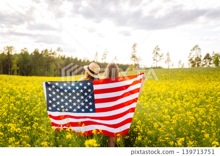 4th of July. Independence Day. Patriotic holiday. USA flag fluttering in the wind. 4th of July. Independence Day. Patriotic holiday. USA flag fluttering in the wind. 139713751